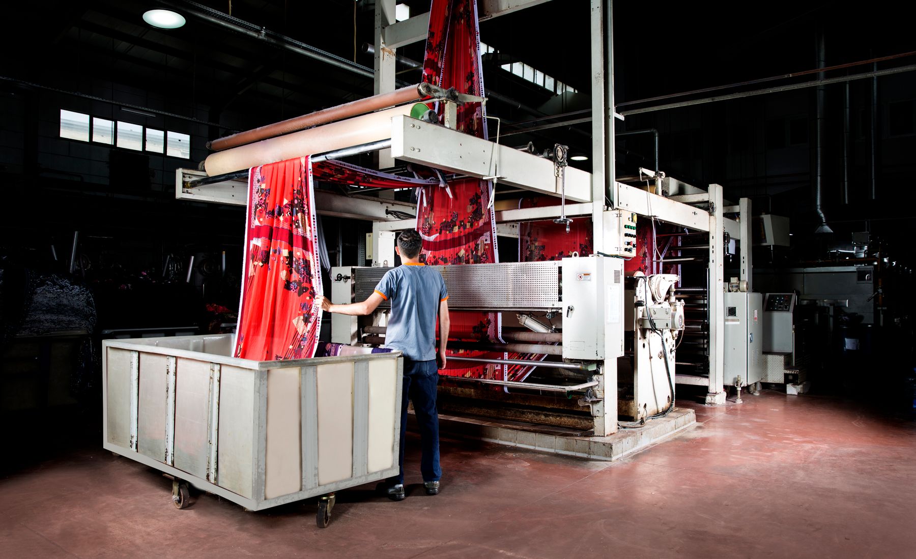 Printed fabric running out of an industrial textile printing machine