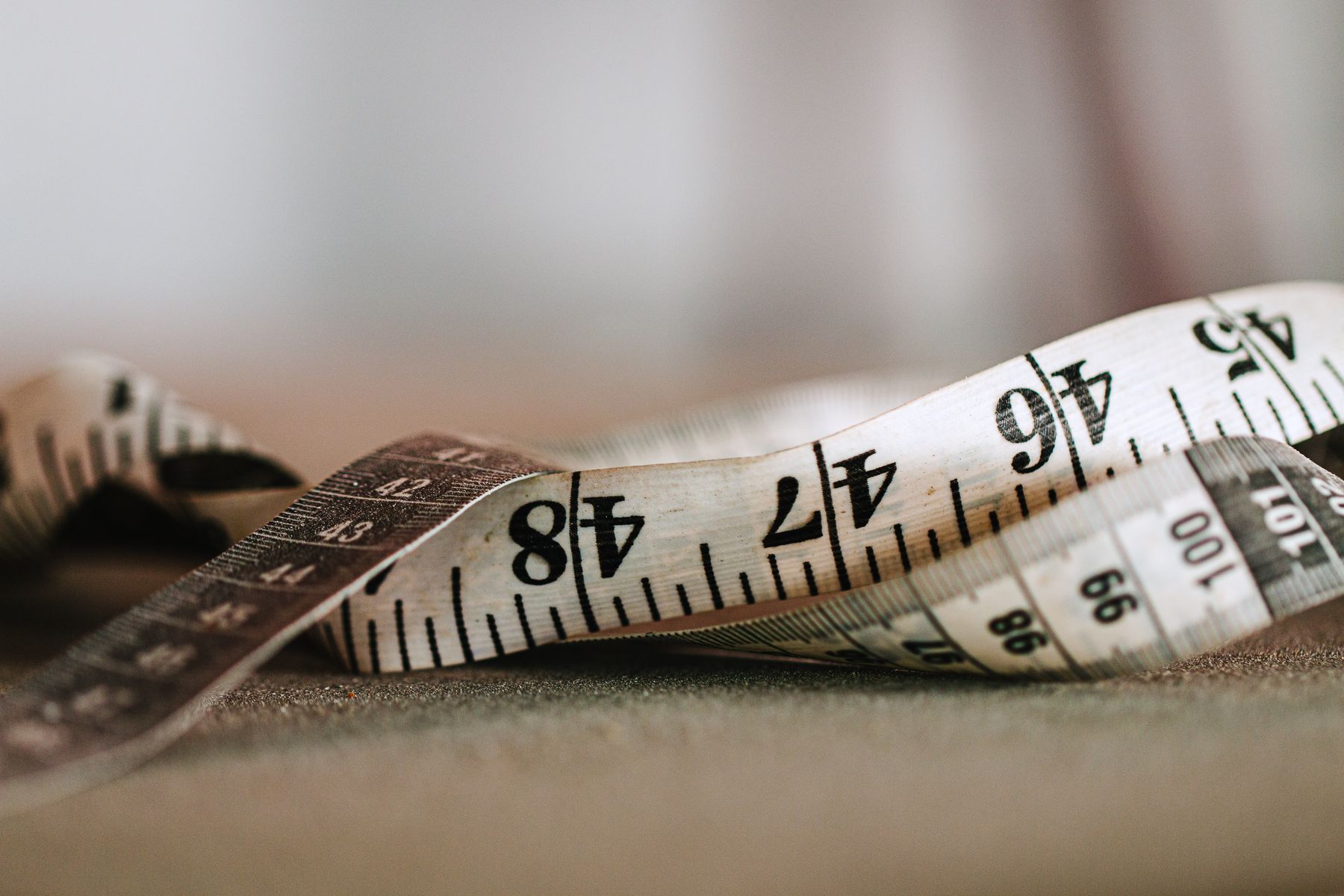 Tape measure coiled on a work surface