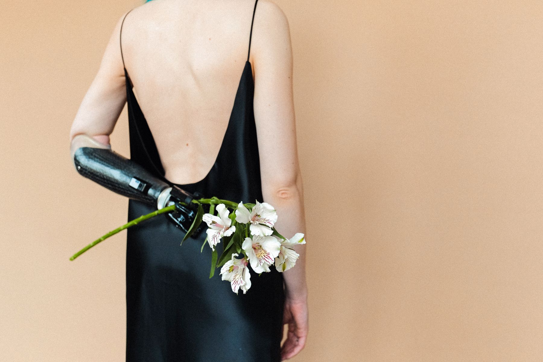 Back view of a black slip with fine shoulder straps